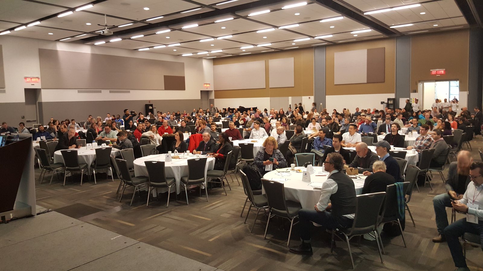 GOAT 2016 audience seated at round tables in the main room