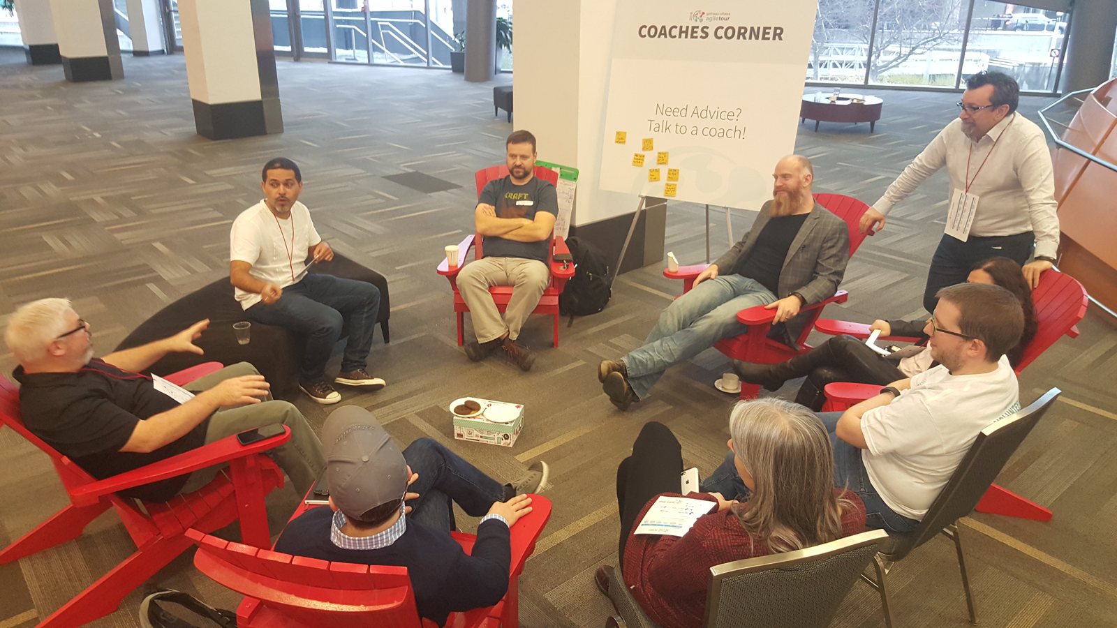 GOAT 2016 coaches corner discussion with participants seated in red chairs