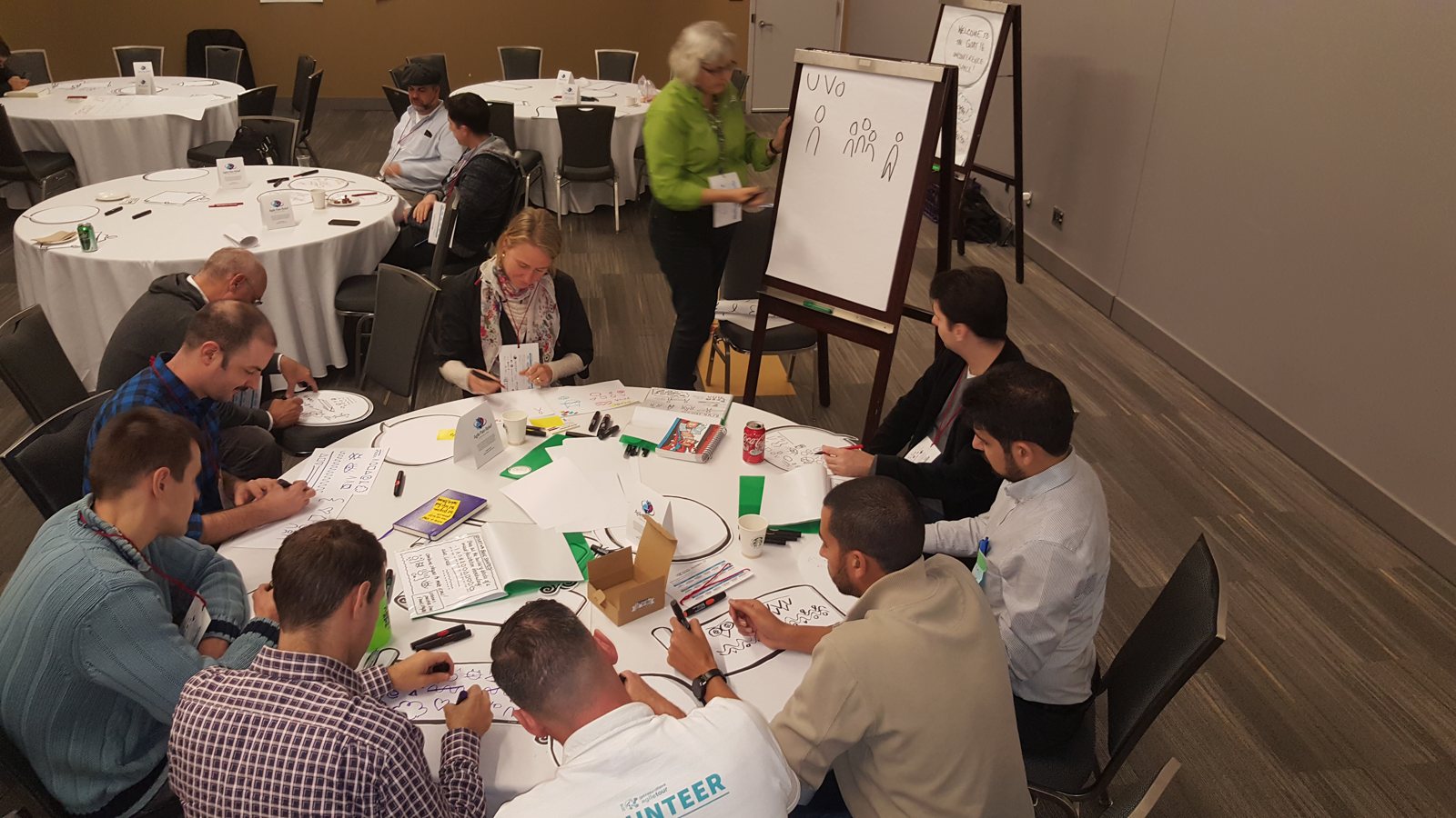 GOAT 2016 workshop participants drawing at a round table