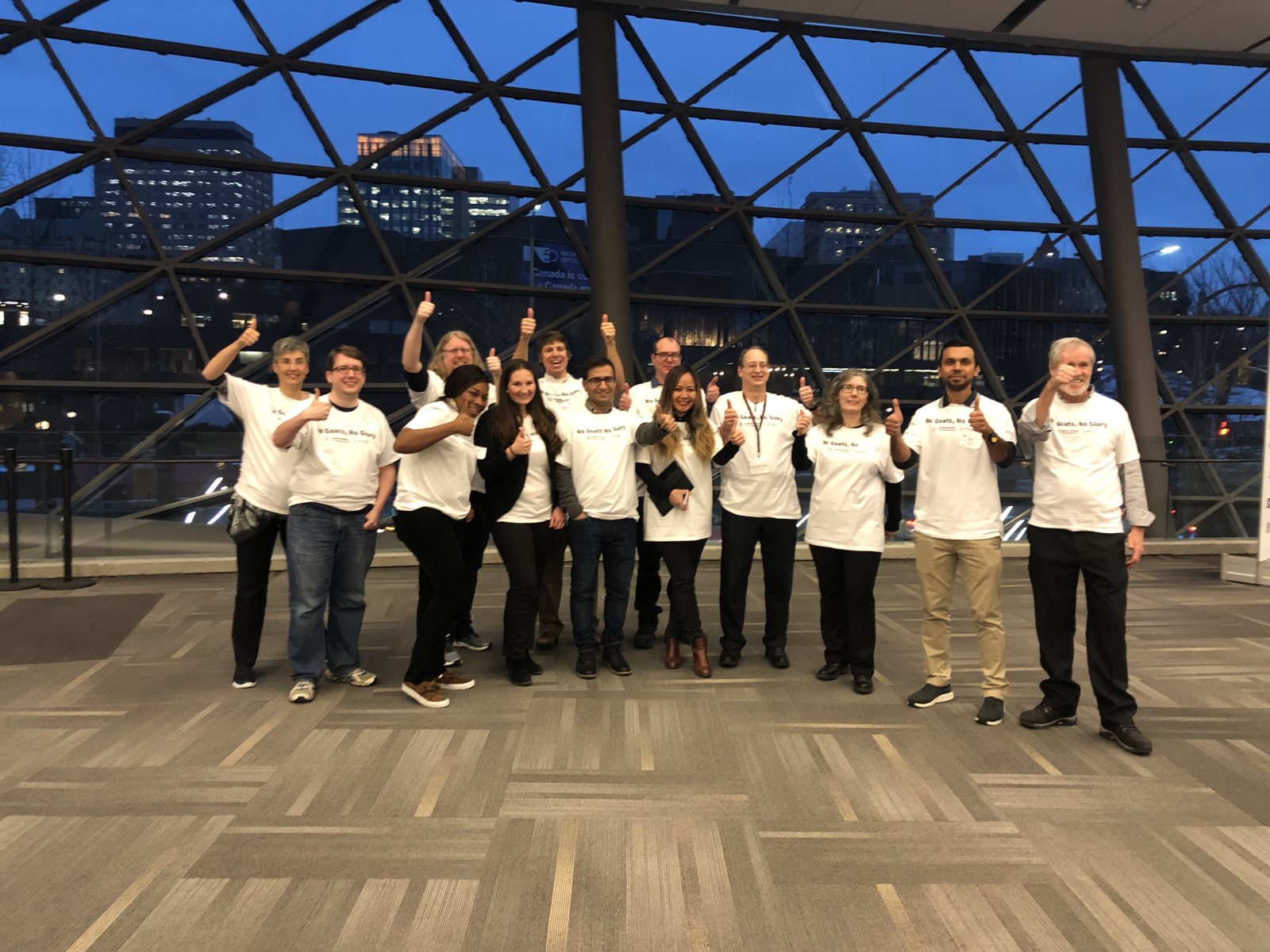 GOAT 2018 team posing by the Shaw Centre windows