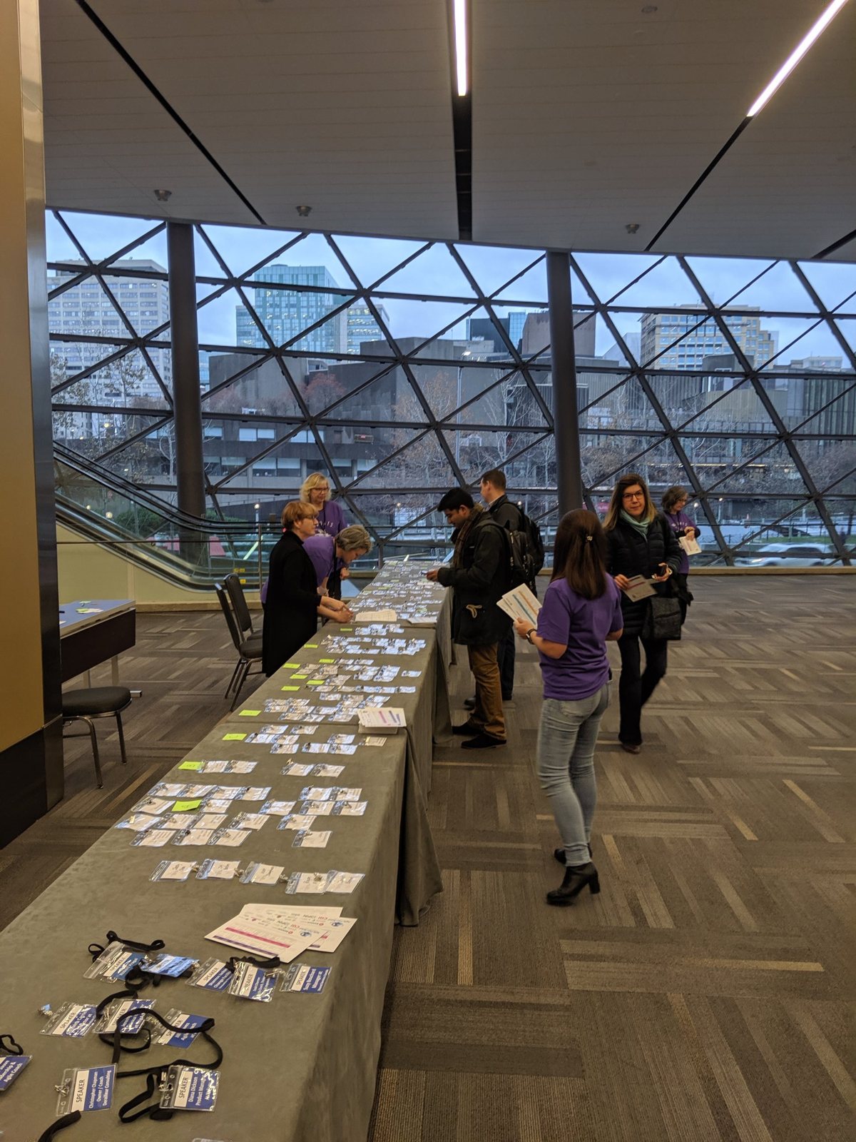 GOAT 2019 registration table with badges laid out near the Shaw Centre windows