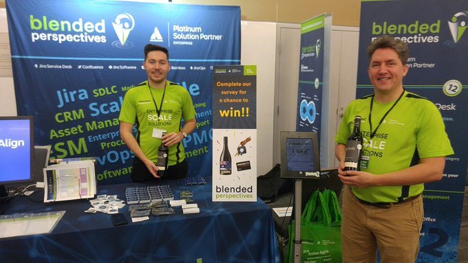 GOAT 2019 sponsor booth with two people standing behind a display table